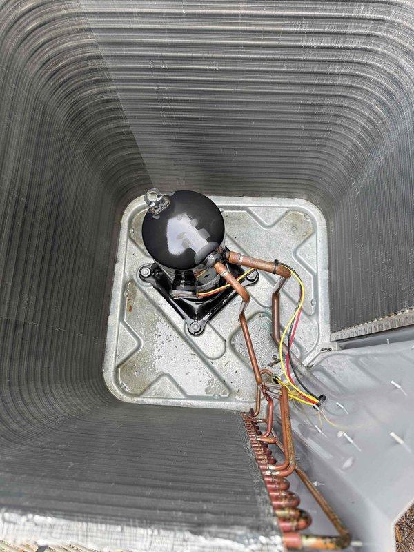 Performed chemical coil cleaning on Lennox outdoor condensing unit. Applied specialized coil cleaning solution to remove dirt, debris, and buildup from condenser coil fins to restore proper heat transfer efficiency and airflow. Unit operational and cooling properly upon completion.