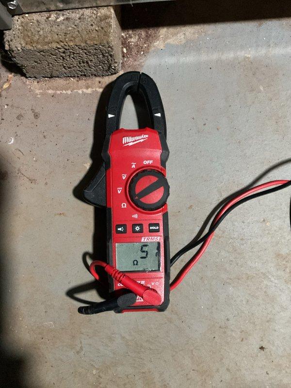 Completed heating maintenance visit for MVP customer. Performed system inspection and diagnostics on heating equipment, including visual assessment of plumbing connections and water heater components. Used Milwaukee clamp meter to verify electrical readings, which measured 5 ohms resistance during testing to ensure proper system operation and safety compliance.
