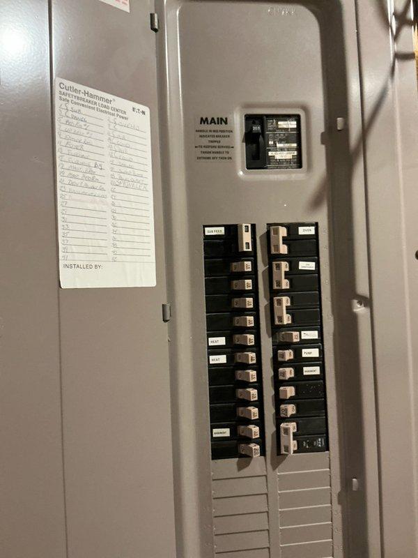 Conducted electrical estimate for whole-house generator installation. Assessed existing electrical panel capacity and configuration, documented current Cutler-Hammer distribution panel with main breaker and circuit layout. Evaluated attic space for potential transfer switch and generator feed wire routing, noting existing utility lines, conduit paths, and structural considerations. Photographed electrical infrastructure and proposed installation areas to provide comprehensive documentation for generator system design and material requirements.