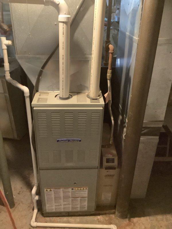 Completed installation of a 90% efficiency American Standard furnace and air conditioning system in basement mechanical room. Installed new air handler with proper ductwork connections, PVC venting for condensate drainage, refrigerant line set, and all necessary electrical connections. System tested and verified operational upon completion.