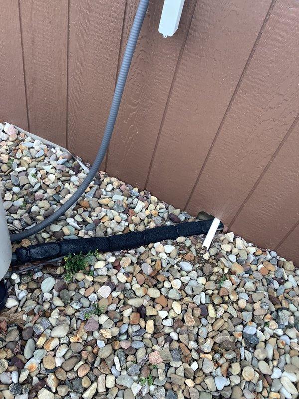 Completed HVAC system replacement estimate for existing 2009 air conditioning unit. Assessed current indoor air handler installation in utility closet and outdoor condenser unit positioned on building exterior with lineset running through landscaped area. Documented equipment conditions, measured existing system specifications, and provided comprehensive replacement quote for complete system upgrade.