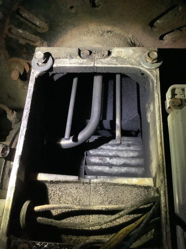 Performed oil furnace maintenance requiring replacement nozzle. Inspected combustion chamber and heat exchanger assembly, noting accumulated soot and carbon deposits on burner components. Ordered necessary nozzle for completion of annual maintenance service, with parts received and customer notified for scheduling of follow-up visit to complete the tune-up procedure.