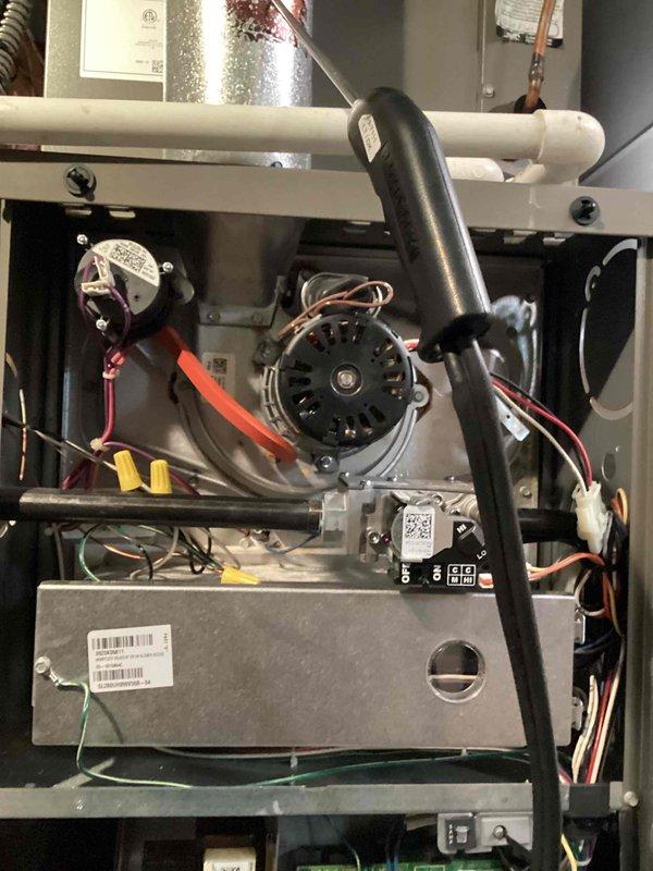Completed BS-MVP recurring heating maintenance visit on residential HVAC system. Performed comprehensive inspection of air handler unit and internal components including blower motor, electrical connections, refrigerant lines, and gas valve assembly. Documented system condition with interior and exterior photographs showing all major components operating within normal parameters. All wire connections, ductwork, and mechanical assemblies verified secure and functioning properly.