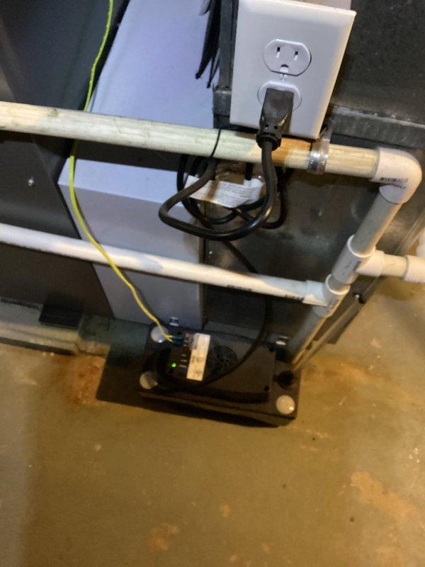 Completed preventive maintenance cooling visit on 5-year-old residential electric air conditioning system located on side of house. Performed standard BS-MVP recurring service protocol including system inspection, filter evaluation, and equipment assessment. All mechanical components, including condensate pump assembly with copper and PVC piping connections, verified operational with proper electrical connections maintained.