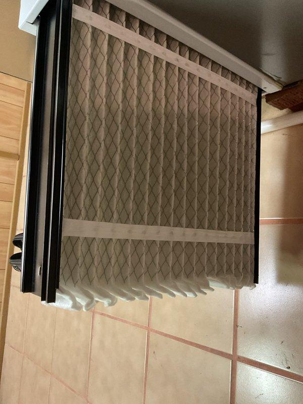 Completed comprehensive AC tune-up and maintenance on 5-year-old Lennox cooling system. Performed inspection of evaporator coil assembly, verified refrigerant lines and connections, checked condensate drain system with PVC drain line, and noted minor rust staining in drain pan area that requires monitoring. Inspected and documented pleated air filter condition in return air housing, confirmed all system components operational, and system performing within normal parameters for continued seasonal use.