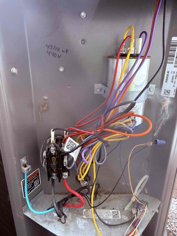 Completed MVP air conditioning maintenance service. Performed comprehensive system inspection and testing, including electrical measurements with multimeter showing 12.72A inrush current reading. Inspected and verified proper operation of contactor assembly and electrical control panel components, confirming 45/14 μF capacitor at 440V specifications with all wire connections secure and functioning within normal parameters.