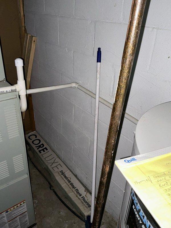 Conducted on-site evaluation for complete HVAC system replacement following air conditioning failure. Assessed existing outdoor condenser unit positioned in exterior corner area between structure and privacy fence, noting electrical disconnect and conduit configuration. Evaluated indoor air handler equipment located in basement utility space and examined existing ductwork infrastructure. Documented current system specifications, electrical service requirements, and installation conditions to develop comprehensive replacement proposal for new HVAC system.