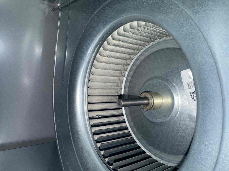 Completed comprehensive AC maintenance service including system inspection and necessary repairs. Performed cleaning of blower wheel assembly which showed significant dust accumulation on the squirrel cage fan blades, and inspected dual-run capacitor with proper wire connections verified. All components tested and system returned to optimal operating condition.