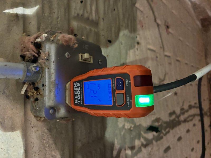 Responded to service call for outdoor sump pump receptacle replacement in 37-year-old residence. Upon arrival, inspected existing electrical outlet serving sump pump system and found heavily corroded receptacle and deteriorated wiring connections due to age and environmental exposure. Verified electrical panel configuration and circuit integrity using digital multimeter to ensure proper voltage and grounding before proceeding with replacement work. Disconnected power at breaker panel, removed failed receptacle, and installed new weather-resistant GFCI outlet suitable for outdoor/damp location applications. Tested new installation for proper operation, ground fault protection functionality, and verified secure mounting. Restored power and confirmed sump pump operational status with new receptacle.