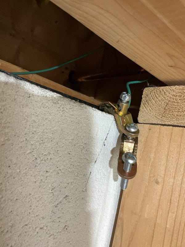 Replaced failed outdoor faucet at rear of property due to cracked vacuum breaker lid causing water leak. Installed new Woodford frost-free faucet with necessary copper pipe and soldered coupling connection to existing water line. Verified proper operation and sealed penetration point through foundation to prevent water intrusion.