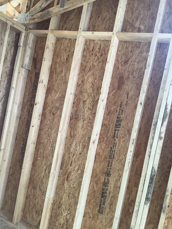 Conducted on-site assessment for HVAC system replacement in building under construction. Evaluated existing conditions and structural framing to determine equipment specifications and installation requirements for new air conditioning and furnace system, documenting construction phase details through photographic documentation of framing and workspace layout.