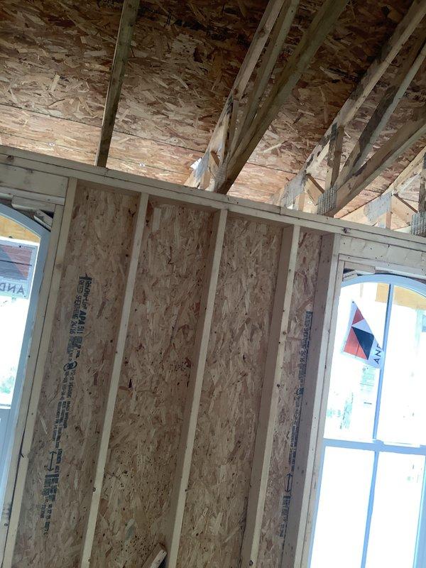 Conducted on-site assessment for HVAC system replacement in building under construction. Evaluated existing conditions and structural framing to determine equipment specifications and installation requirements for new air conditioning and furnace system, documenting construction phase details through photographic documentation of framing and workspace layout.