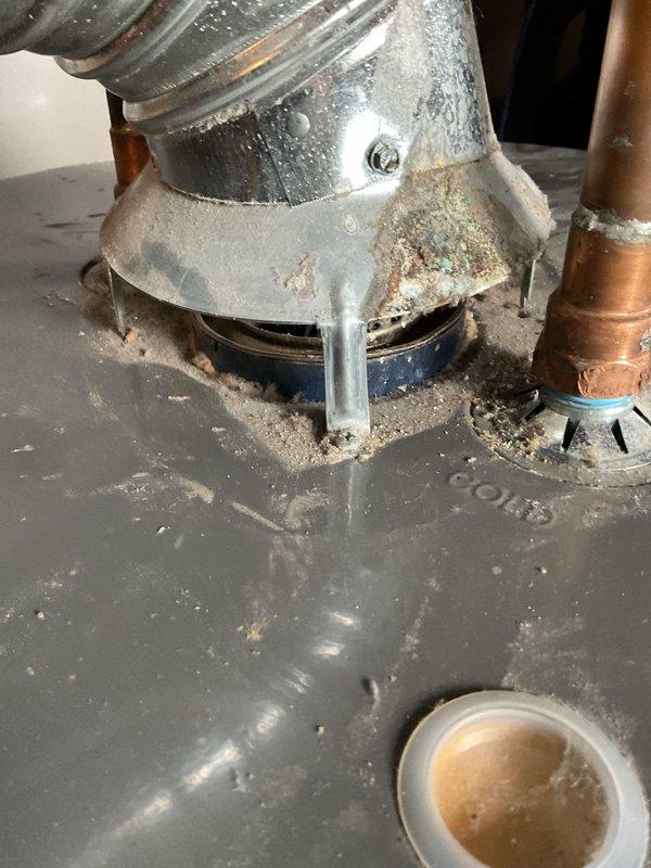 Responded to service call for 7-year-old tanked water heater with pilot light ignition failure located in basement. Upon arrival, performed diagnostic inspection of gas control valve, thermocouple, and pilot assembly. Found thermocouple had failed, preventing proper flame detection and causing pilot safety lockout. Replaced faulty thermocouple with OEM-spec component, cleaned pilot orifice of accumulated debris, and verified proper gas flow to pilot assembly. Re-lit pilot light, confirmed stable flame with adequate blue color and proper flame envelope around thermocouple tip. Tested main burner ignition sequence and verified normal operation through complete heating cycle. Inspected water heater for additional issues, noting minor corrosion at base and age-related wear consistent with unit's service life. All safety controls functioning properly upon completion. Unit restored to full operational status.