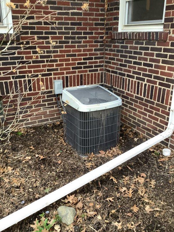Completed full HVAC system installation including an 80% efficiency furnace unit in the basement mechanical room and a matching air conditioning condenser unit on the exterior of the property. The furnace was installed with proper ductwork connections, copper refrigerant line sets, electrical wiring, and all necessary safety controls. The outdoor condenser was positioned in a corner location against the brick foundation with adequate clearance for airflow and future service access. All components were tested and verified operational upon completion.