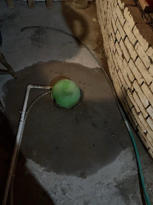 Responded to sewer line backup at residential property over 100 years old. Upon arrival, accessed basement utility area via back entrance and assessed plumbing system. Located main sewer line obstruction causing backup into basement floor drain area. Utilized professional drain cleaning equipment to clear blockage from aged cast iron and PVC piping system. Extensive water staining on concrete floor indicated previous drainage issues consistent with aging infrastructure. Successfully restored proper flow and drainage through main sewer line. Tested system operation and confirmed full functionality of floor drain and connected plumbing fixtures. Documented existing conditions of aged plumbing components including deteriorated vertical stack and insulated waste lines for maintenance records.