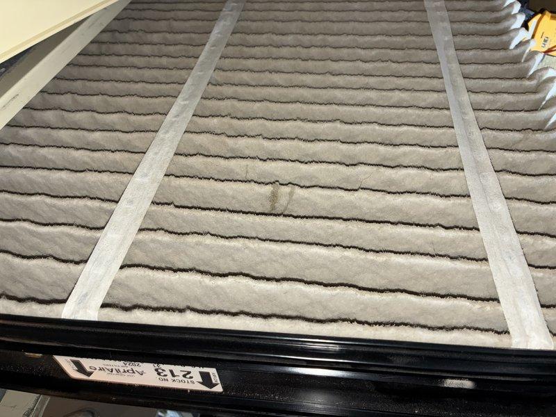 Completed routine maintenance on two residential air conditioning units. Inspected Lennox system located in attic space, verified manufacturer specifications and AHRI certification, and documented unit model and serial numbers. Replaced dirty pleated air filter showing significant dust accumulation to restore proper airflow and system efficiency.