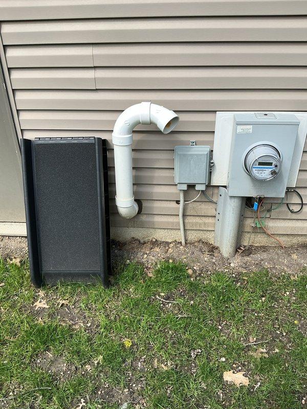 Responded to service call for failed hot water tank in 22-year-old residential property. Upon arrival, assessed existing water heater system and confirmed unit was no longer operational. Proceeded with complete water heater replacement, installing new Bradford White Defender Safety System unit with Energy Star certification. 

Connected all copper supply and discharge piping with proper fittings and joints. Installed pressure relief valve and safety components per manufacturer specifications. Integrated white PVC venting system to exterior wall, ensuring proper combustion air intake and exhaust ventilation. Installed blue shut-off valve on cold water supply line for future serviceability. Verified all connections for proper sealing and tested system for leaks.

Mounted electrical components and verified proper grounding. Ensured adequate clearances around unit per code requirements. System tested and confirmed operational with proper hot water delivery throughout residence.