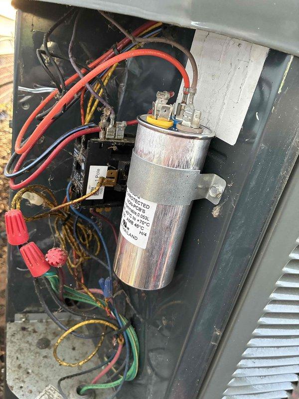 Completed comprehensive AC tune-up including inspection of blower motor assembly, condenser fan, and electrical components. Verified capacitor connections and wiring integrity, checked motor shaft condition and heat dissipation fins for proper operation. All system components found operating within normal parameters with no repairs required at this time.