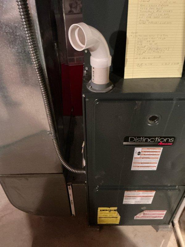 Conducted comprehensive estimate for replacement of 19-year-old furnace and air conditioning system. Assessed existing Distinctions brand furnace installation including PVC venting configuration, ductwork connections, and overall system condition. Documented current equipment setup and discussed BOGO promotional options for complete HVAC system replacement with both heating and cooling units.