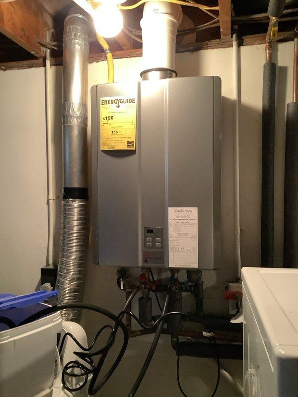 Performed descaling maintenance on a 13-year-old Rinnai natural gas tankless water heater. Flushed the heat exchanger with descaling solution to remove mineral buildup and restore optimal heating efficiency. Inspected internal components, verified proper operation of gas valves and controls, and confirmed unit returned to normal function upon completion.