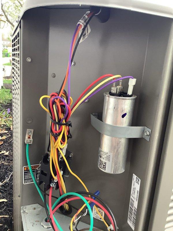 Completed scheduled MVP cooling maintenance visit on Lennox outdoor condensing unit. Performed comprehensive system inspection including electrical connections, capacitor testing, and overall unit condition assessment. Accessed control panel to examine wiring harness, dual-run capacitor, and terminal connections. All electrical components found to be properly secured with clean connections and no signs of corrosion or deterioration. Capacitor tested within acceptable parameters. Exterior cabinet and coil condition inspected with no visible damage noted. Unit operational and performing to manufacturer specifications.