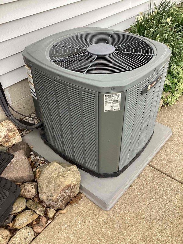 Completed scheduled MVP cooling maintenance visit on 11-year-old residential air conditioning system. Performed comprehensive inspection of outdoor condenser unit, verified proper operation of fan motor and compressor, checked refrigerant levels, and cleaned condenser coils. Unit found in good working condition with normal wear consistent with age, all components functioning within manufacturer specifications.