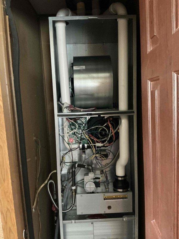 Completed estimate for adding air conditioning system to mobile home with existing heating unit. Assessed current vertical air handler installation housed in under-floor cabinet space and evaluated requirements for integrating cooling components including outdoor condensing unit, refrigerant line set, electrical upgrades, and condensate drainage modifications to create complete HVAC system.