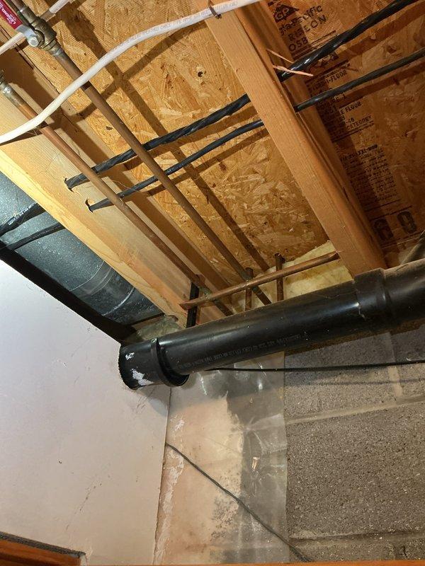 Conducted on-site assessment for installation of Aquasana reverse osmosis water filtration system under kitchen sink. Inspected existing under-sink plumbing configuration, including PVC P-trap assembly, flexible water supply lines, and cabinet space. Observed existing drain connections showing signs of mineral deposits and water staining around threaded couplings. Evaluated basement utility routing to determine optimal water supply line connection point and drain line integration for RO system waste water discharge. Assessed cabinet dimensions and existing plumbing layout to confirm adequate clearance for filtration unit, storage tank, and dedicated faucet installation. Provided comprehensive estimate for complete reverse osmosis system installation including all necessary fittings, supply line connections, and drain saddle valve.