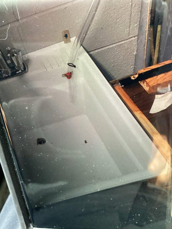 Responded to service call for newly installed furnace with water leakage from side panel. Inspected unit and identified condensate drainage issue, secured copper condensate line with proper hose clamp, and verified drain valve operation. Adjusted air filter access panel to eliminate obstruction that was preventing easy filter removal and replacement.