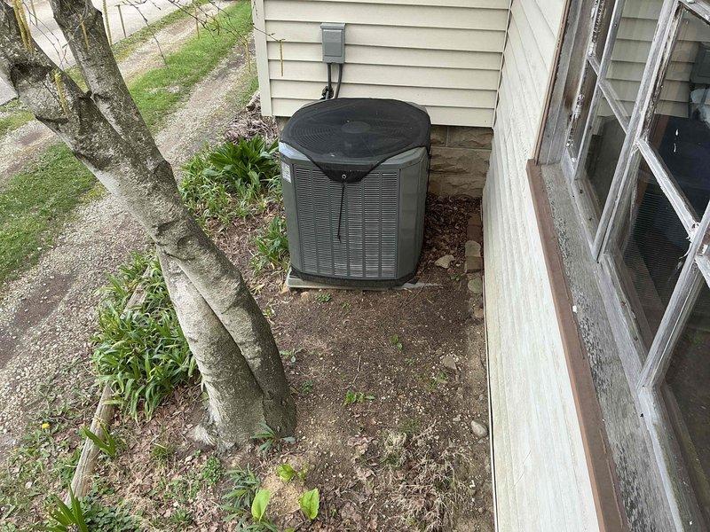 Provided comprehensive estimate for replacement of 13-year-old gas furnace with cracked heat exchanger and air conditioning system with low refrigerant due to stuck Schrader core valve. Documented existing equipment condition in basement mechanical room and exterior condenser unit location. Presented options for complete HVAC system replacement to address multiple critical component failures requiring extensive repairs.