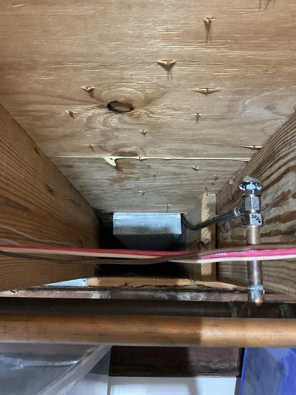 Replaced existing refrigerator water feed line with new braided stainless steel supply line and installed new shut off valve. Removed old copper piping connection and upgraded system to provide improved reliability and leak protection for refrigerator water supply.
