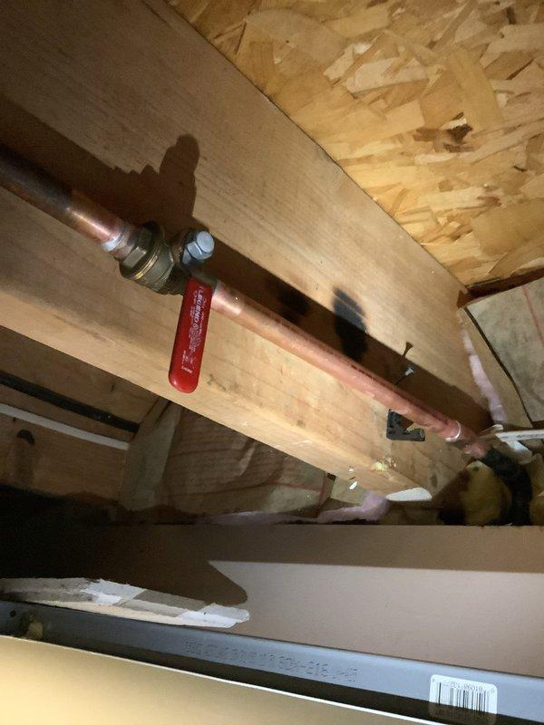 Responded to exterior spigot failure where ball valve had separated from the faucet body. Due to repeated disconnection issues and non-functional crimping equipment, soldered the ball valve directly to the exterior faucet assembly to provide a permanent, leak-proof connection. Replaced failed compression fittings with soldered copper joints on the water supply line to ensure long-term reliability and prevent future separation of components.