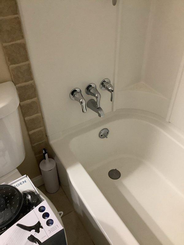 Responded to emergency call for malfunctioning bathtub faucet that could not be shut off, requiring main water supply to be turned off to stop flow. Inspected 10-year-old three-handle chrome faucet system on 40-year-old plumbing infrastructure. Assessed condition of existing fixtures and determined replacement necessary. Inspected under-sink drains as requested and evaluated overall plumbing system condition. Provided customer with Moen replacement shower head options and discussed fixture upgrade recommendations to prevent future failures.