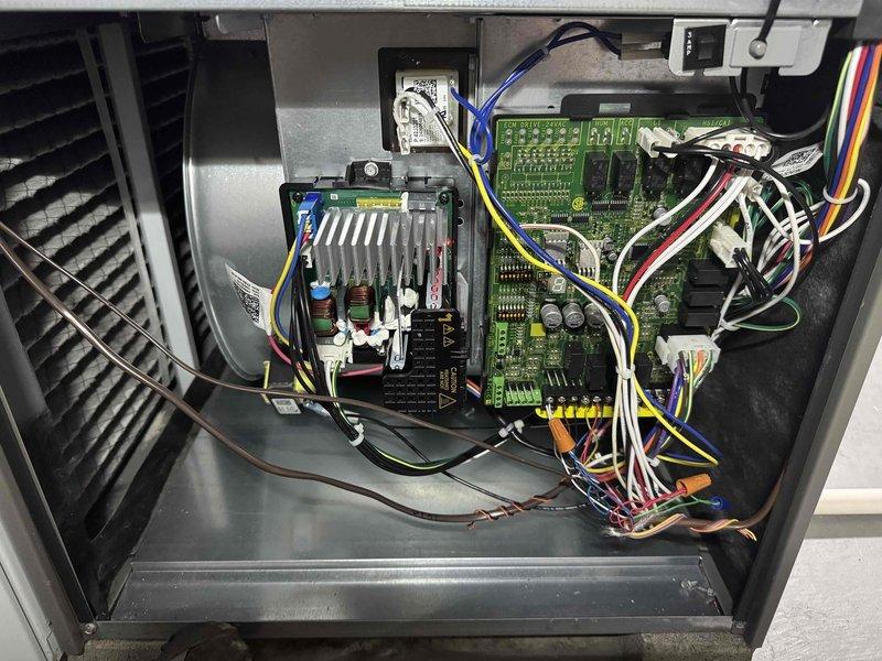 Completed routine HVAC maintenance visit for MVP customer. Performed comprehensive system inspection, documenting electrical control panel components including capacitor, wiring connections, and safety disconnect switch in outdoor condensing unit. Inspected indoor air handler assembly, verifying blower motor operation and examining control boards, power supply modules, and electrical connections throughout the system. All components photographed and found to be in operational condition with normal wear patterns consistent with system age.