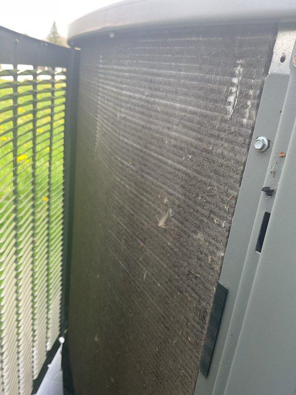 Completed annual AC maintenance tune-up to maintain warranty compliance. Inspected evaporator coil assembly showing normal dust accumulation and verified proper refrigerant line connections. Documented heavily soiled condenser coil with significant dirt and debris buildup restricting airflow through aluminum fins; unit requires professional coil cleaning to restore optimal heat transfer efficiency and system performance.