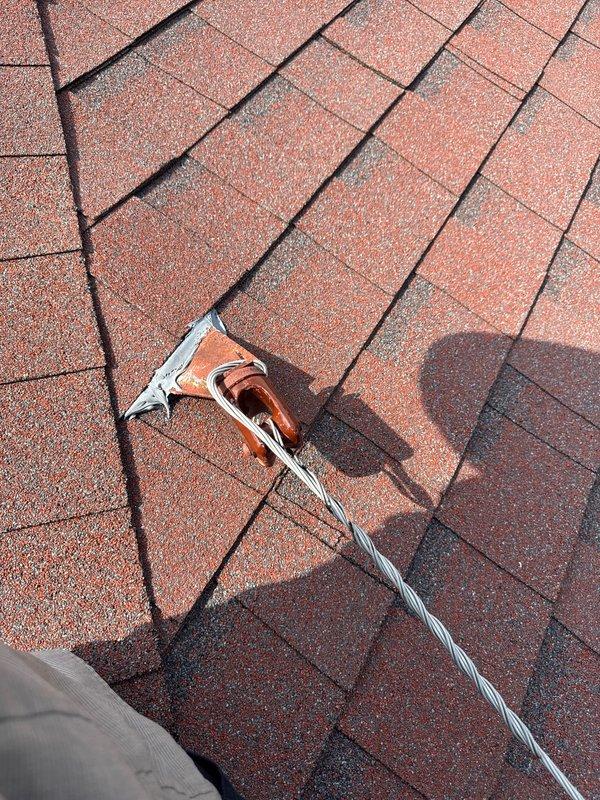 Relocated point of attachment on service mast to maximum height as required for upcoming electrical inspection. Previous attempt had been delayed due to icy conditions preventing safe roof access. Successfully completed warranty work with mast repositioning finalized and verified for compliance prior to scheduled inspection.