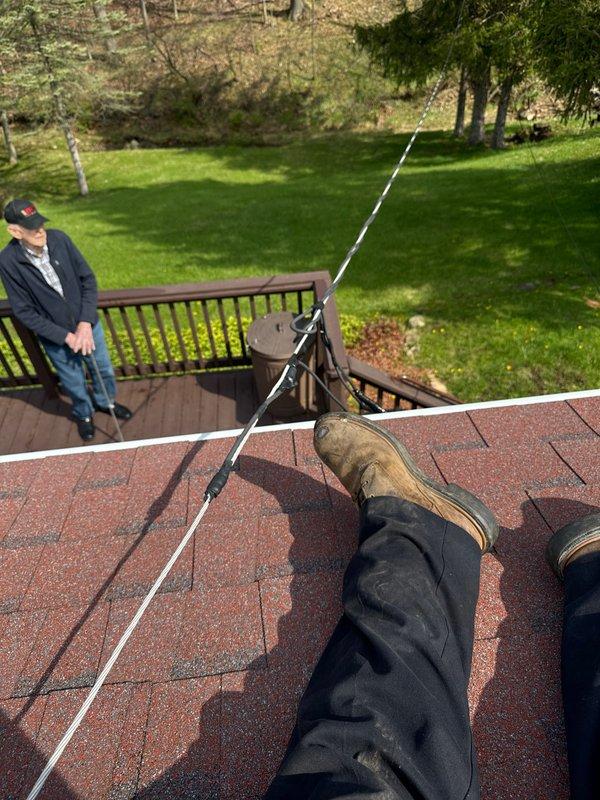 Relocated point of attachment on service mast to maximum height as required for upcoming electrical inspection. Previous attempt had been delayed due to icy conditions preventing safe roof access. Successfully completed warranty work with mast repositioning finalized and verified for compliance prior to scheduled inspection.