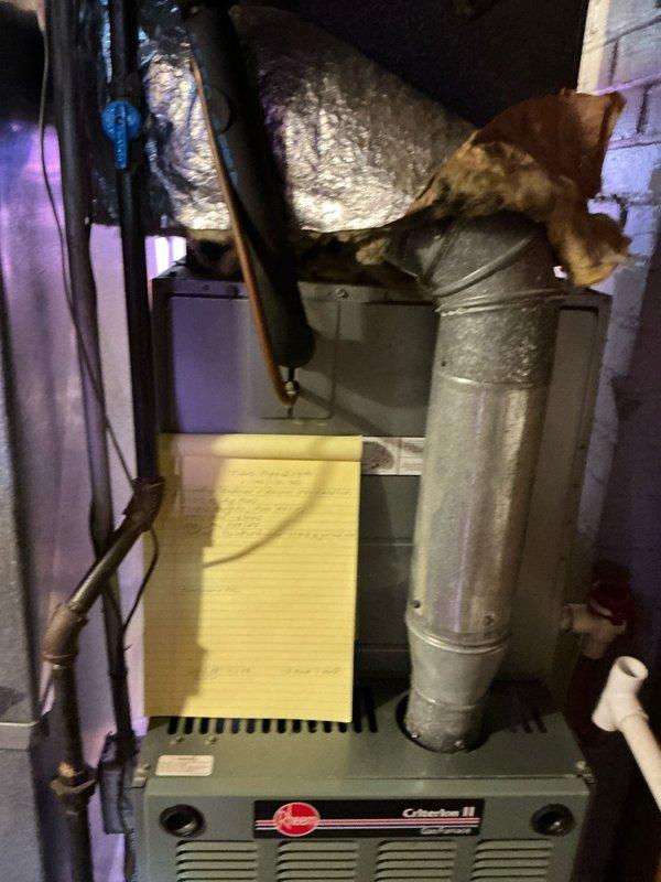 Completed comprehensive HVAC system replacement estimate for residential property. Assessed existing Criterion II furnace installation in basement utility area with deteriorating ductwork insulation and aging yellow pleated air filter, along with exterior condensing unit showing significant weathering, grime accumulation on grille panels, and ground-level placement concerns. Provided detailed replacement recommendations for complete heating and cooling system upgrade to improve efficiency and reliability.