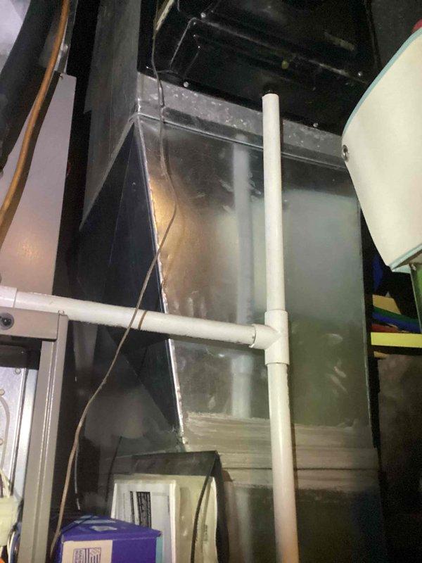 Completed comprehensive AC tune-up on residential outdoor condensing unit and inspected indoor air handler system. Unit exterior showed significant accumulation of dirt, debris, and environmental contaminants; cleaned and cleared all obstructions from cabinet surfaces and surrounding area. Verified proper airflow, checked refrigerant levels, inspected electrical connections, and confirmed system operational parameters within manufacturer specifications.