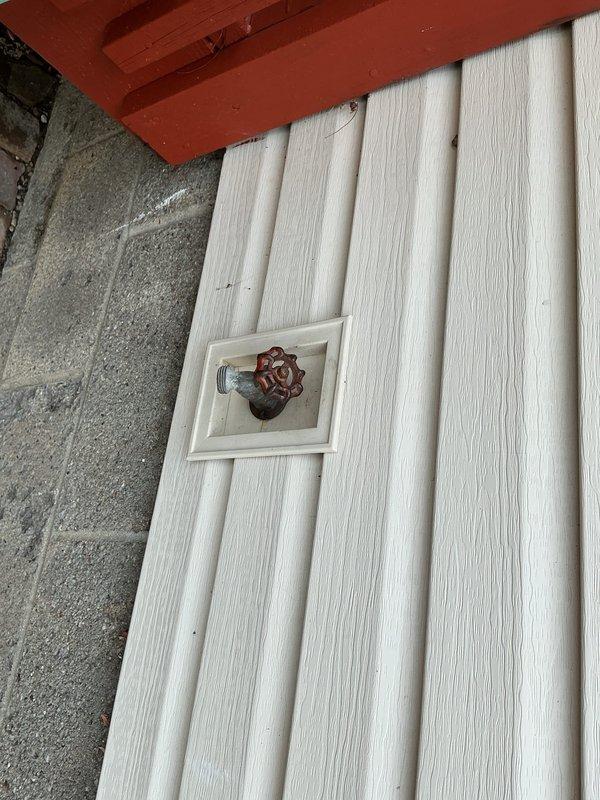 Successfully replaced an aging outdoor spigot on a 1963-built home. Removed the existing corroded exterior hose bib and installed a new frost-free sillcock with a wheel-handle valve, mounting it securely to the exterior white panel siding. Located and accessed the interior shutoff valve in the basement crawl space to properly isolate the water supply during replacement. Verified proper operation of both the new exterior spigot and interior shutoff valve, testing for leaks and confirming adequate water flow upon completion.