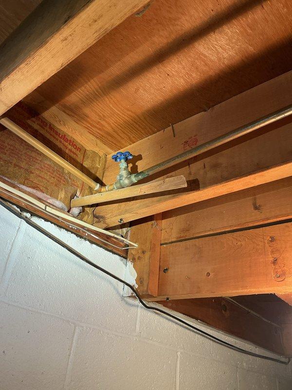 Successfully replaced an aging outdoor spigot on a 1963-built home. Removed the existing corroded exterior hose bib and installed a new frost-free sillcock with a wheel-handle valve, mounting it securely to the exterior white panel siding. Located and accessed the interior shutoff valve in the basement crawl space to properly isolate the water supply during replacement. Verified proper operation of both the new exterior spigot and interior shutoff valve, testing for leaks and confirming adequate water flow upon completion.