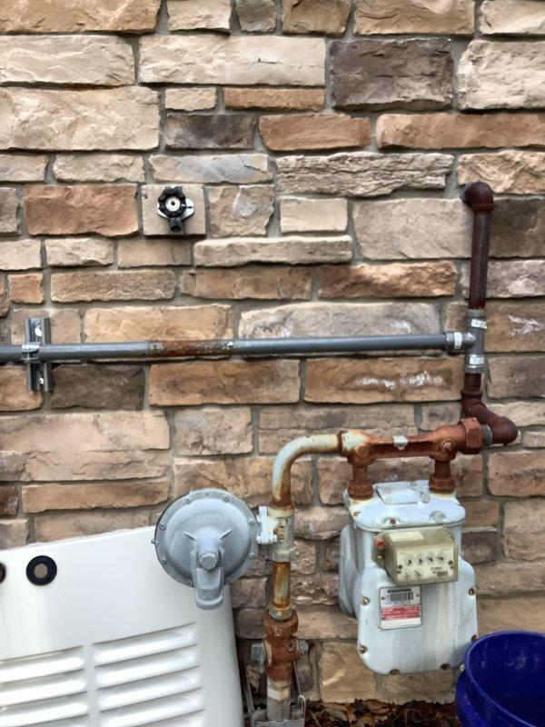 Performed routine preventive maintenance on residential standby generator system. Conducted comprehensive inspection of unit including visual assessment of gas meter connections, supply piping, and associated fittings which showed signs of corrosion on copper components. Verified generator control panel operation with all indicator lights functioning properly and confirmed unit powers on successfully. Documented existing condition of gas supply infrastructure and generator equipment with photographic records for service history.