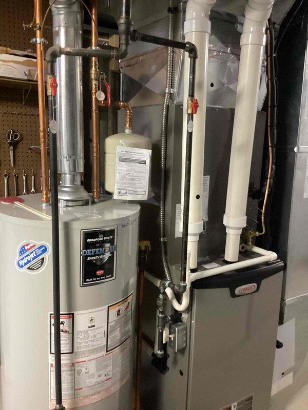 Completed scheduled MVP cooling maintenance visit on residential HVAC system. Performed comprehensive inspection of Lennox furnace and associated cooling components, including ductwork, refrigerant lines, and electrical connections. Verified proper operation of all safety controls, checked condensate drainage system with white PVC piping, and inspected Bradford White water heater integration with HVAC system. All equipment found operating within normal parameters with no issues identified.