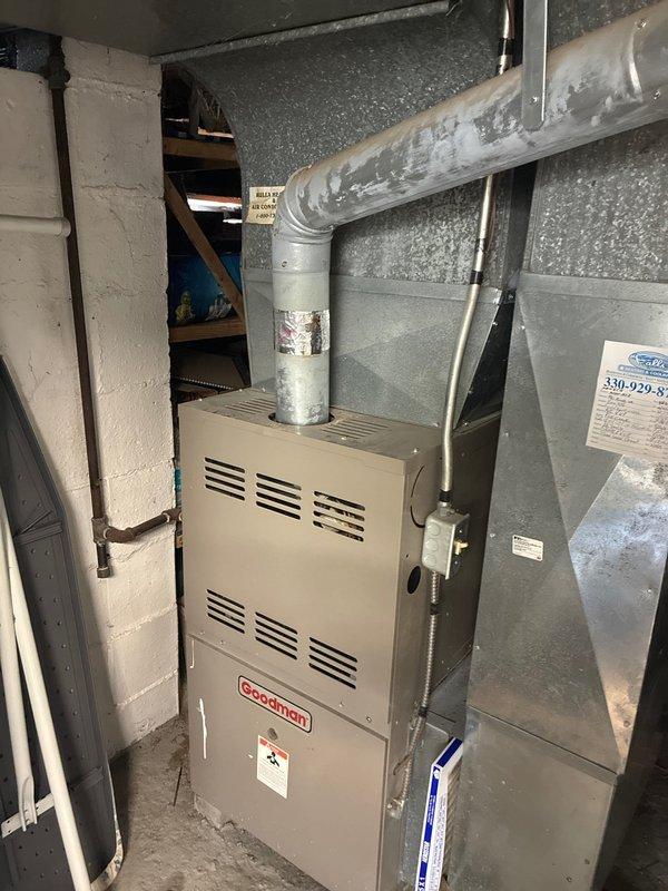 Completed MVP Cooling Visit on a 23+ year old Goodman forced-air system. Inspected furnace and air handler unit in basement mechanical room, evaluated ductwork connections and plenum assembly. Documented heavily soiled air filter requiring replacement due to significant dust and debris accumulation restricting airflow. System operational following maintenance protocol.