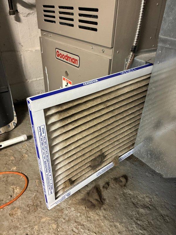 Completed MVP Cooling Visit on a 23+ year old Goodman forced-air system. Inspected furnace and air handler unit in basement mechanical room, evaluated ductwork connections and plenum assembly. Documented heavily soiled air filter requiring replacement due to significant dust and debris accumulation restricting airflow. System operational following maintenance protocol.