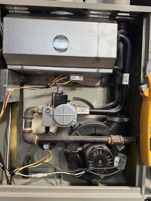 Completed annual tune-up on 11-year-old air conditioning system. Performed comprehensive inspection of outdoor condensing unit and indoor furnace components, including compressor motor, electrical connections, gas valve assembly, and blower motor. Verified proper operation of all system components, cleaned condenser coil, checked refrigerant levels, tested capacitor and contactor functionality, and confirmed all electrical connections were secure with no signs of overheating or damage.