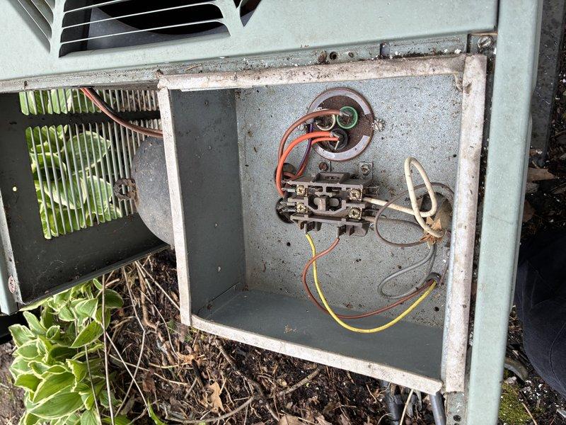 Completed comprehensive tune-up maintenance on 15-year-old residential air conditioning system. Accessed outdoor condenser unit, inspected electrical components including capacitor and wiring connections, verified condenser fan operation, and evaluated overall system condition. Unit shows age-appropriate wear with weathering on exterior surfaces but remains operational; all electrical connections secure and functional at time of service.