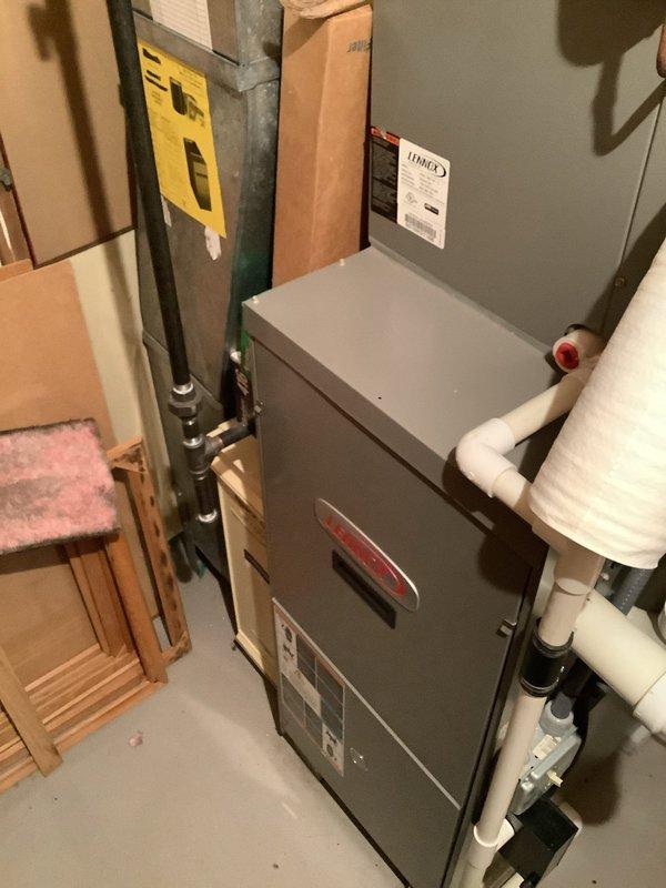 Responded to no cooling complaint on residential split system. Upon arrival, confirmed outdoor condensing unit running but home not reaching setpoint temperature. Inspected outdoor unit and noted handwritten service notation indicating refrigerant addition on 6-5-25. Documented system information and captured unit data plate details. Examined indoor air handler and associated components in basement installation. Contacted Aegis home protection plan to report findings and verify coverage authorization prior to proceeding with diagnostic testing and repairs.