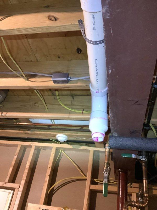 Installed dedicated electrical circuit for tankless water heater power wire installation as scheduled. Ran new wiring through unfinished basement ceiling joists, coordinating routing with existing plumbing infrastructure including PVC drainage lines and insulated copper water lines to ensure proper clearances and code compliance.