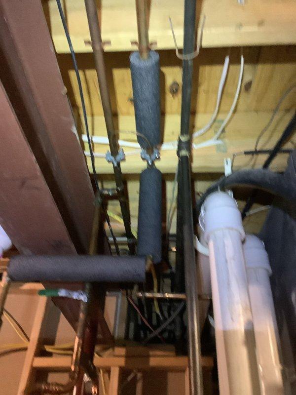 Installed dedicated electrical circuit for tankless water heater power wire installation as scheduled. Ran new wiring through unfinished basement ceiling joists, coordinating routing with existing plumbing infrastructure including PVC drainage lines and insulated copper water lines to ensure proper clearances and code compliance.